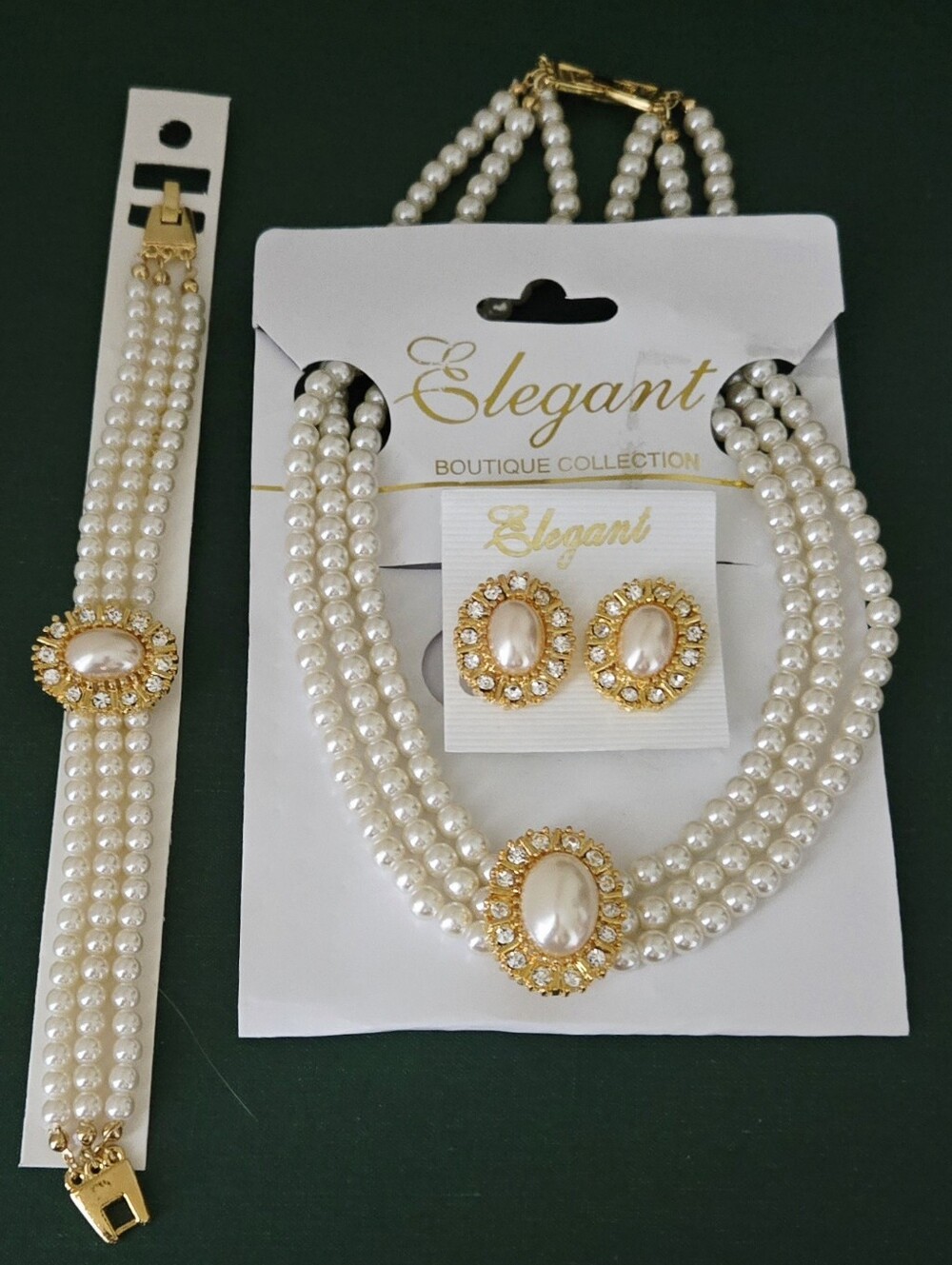 White Pearl Three-Strand Necklace Bracelet Clip Earrings Set with Gold Accents